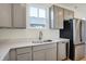 Stylish kitchen with gray cabinets, stainless steel appliances, and ample counter space for cooking and prep at 3923 Wren Dr, Brownsburg, IN 46112