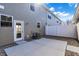Back patio featuring concrete, rock ground cover, and access door to the house at 3923 Wren Dr, Brownsburg, IN 46112