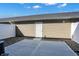Back patio with concrete, rock ground cover, siding and door to the house at 3923 Wren Dr, Brownsburg, IN 46112