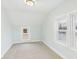 Bright bedroom with two windows and neutral carpet creating a cozy and inviting atmosphere at 411 W Memorial Dr, Muncie, IN 47302