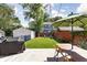 Spacious backyard featuring a grill, patio seating, and a well-maintained lawn, perfect for outdoor gatherings at 4707 N Park Ave, Indianapolis, IN 46205