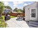 Outdoor patio with a grill, dining table, seating, and privacy fence at 4707 N Park Ave, Indianapolis, IN 46205