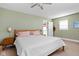 Cozy bedroom featuring a queen-sized bed, nightstands, and light green walls at 4707 N Park Ave, Indianapolis, IN 46205
