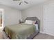 Comfortable bedroom with neutral tones, cozy bed and linen, and ample natural light at 4707 N Park Ave, Indianapolis, IN 46205