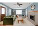 Stylish living room featuring a cozy fireplace, comfortable seating, and natural light at 4707 N Park Ave, Indianapolis, IN 46205