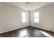 Bedroom boasting hardwood floors, wainscoting, natural light from dual windows at 4929 Young Ave, Indianapolis, IN 46201