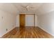 Spacious bedroom with wood-look flooring, ceiling fan and closet at 4929 Young Ave, Indianapolis, IN 46201