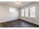 Bright bedroom featuring natural light, neutral paint, fresh trim, and new floors at 4929 Young Ave, Indianapolis, IN 46201