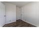 Bedroom features hardwood floors, wainscoting, baseboard trim, and white doors at 4929 Young Ave, Indianapolis, IN 46201
