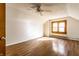 Large, bright bedroom featuring wood-look flooring and a ceiling fan at 4929 Young Ave, Indianapolis, IN 46201
