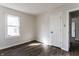 Bedroom featuring hardwood floors, wainscoting, trim, and natural light at 4929 Young Ave, Indianapolis, IN 46201