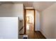 Hallway leading to bedroom shows wood-look flooring and white walls at 4929 Young Ave, Indianapolis, IN 46201