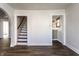 Spacious hallway leading to the upper level and a separate room, providing open and easy access at 4929 Young Ave, Indianapolis, IN 46201