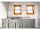 Kitchen featuring granite countertops, double stainless steel sink, gray cabinets, and open shelving at 4929 Young Ave, Indianapolis, IN 46201