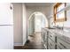 Charming kitchen with granite counters, white appliances, gray cabinets, and hardwood floors at 4929 Young Ave, Indianapolis, IN 46201