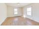 Cozy bedroom with hardwood floors and windows providing natural light at 518 Central S Ct, Indianapolis, IN 46205