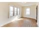 This bright bedroom features natural light and original hardwood floors at 518 Central S Ct, Indianapolis, IN 46205