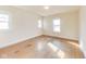 Bright bedroom with wood floors, two windows, and ample natural light at 518 Central S Ct, Indianapolis, IN 46205