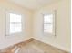 This bedroom features two windows and hardwood floors at 518 Central S Ct, Indianapolis, IN 46205