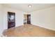 Bedroom featuring hardwood floors and two stained, paneled doors at 518 Central S Ct, Indianapolis, IN 46205