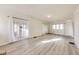 Open living room featuring bright walls and light wood-look floors, and white accents at 518 Central S Ct, Indianapolis, IN 46205