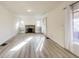 Bright living room featuring a fireplace and mantle, built-in shelving, and light floors at 518 Central S Ct, Indianapolis, IN 46205