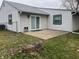 Backyard featuring a small patio perfect for outdoor gatherings, with a mix of lawn and natural wooded areas at 5212 Mason Cir, Indianapolis, IN 46254