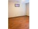Minimalist bedroom with light walls and gleaming hardwood floors, ready for personal decoration at 5212 Mason Cir, Indianapolis, IN 46254