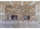 Close-up of large brick fireplace with two openings in unfinished basement at 5309 Michael Ct, Brownsburg, IN 46112