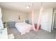 Bright bedroom features playful decor, and a whimsical pink hanging swing at 5897 W River Chase Ln, McCordsville, IN 46055