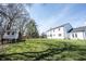 Backyard view featuring a playhouse, green lawn and plenty of space at 6149 W Country Ln, Anderson, IN 46011