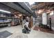 Unfinished basement with exposed beams, concrete floors, and some equipment; great for customization at 6149 W Country Ln, Anderson, IN 46011