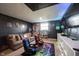 Finished basement featuring a gaming zone with gaming chairs, a TV and a couch at 6149 W Country Ln, Anderson, IN 46011