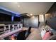 Finished basement features a gaming area, TV, and comfortable seating, great for entertainment at 6149 W Country Ln, Anderson, IN 46011