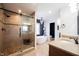 Tiled bathroom with a sliding glass shower, soaking tub, and vanity at 6149 W Country Ln, Anderson, IN 46011