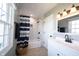 Bright bathroom with subway tile, new fixtures, gray walls, and a shower/tub with blue and white striped curtain at 6149 W Country Ln, Anderson, IN 46011
