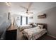 Spacious shared bedroom with two twin beds, mountain-themed decor, and a ceiling fan at 6149 W Country Ln, Anderson, IN 46011