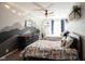 Shared bedroom with twin beds featuring fox-themed bedding and a gray mountain mural on the wall at 6149 W Country Ln, Anderson, IN 46011