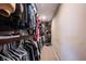 Walk-in closet with lots of clothing and storage shelves at 6149 W Country Ln, Anderson, IN 46011