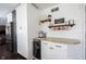 Charming coffee bar with built-in beverage fridge and granite countertop on custom cabinetry at 6149 W Country Ln, Anderson, IN 46011