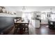 Open dining area with wood table, decor shelves, and easy access to the kitchen at 6149 W Country Ln, Anderson, IN 46011