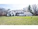A beautiful two-story home with a landscaped yard and charming front porch on a sunny day at 6149 W Country Ln, Anderson, IN 46011