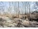 Custom fire pit area with natural stone seating in a private backyard setting at 6149 W Country Ln, Anderson, IN 46011