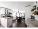 Modern kitchen featuring granite countertops, stainless steel appliances, and a view into the living room at 6149 W Country Ln, Anderson, IN 46011