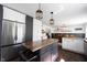 Modern kitchen featuring stainless steel appliances, a center island, and stylish pendant lighting at 6149 W Country Ln, Anderson, IN 46011
