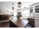 Bright kitchen featuring a butcher block island, farmhouse sink, and stainless steel appliances at 6149 W Country Ln, Anderson, IN 46011