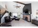 Open living room featuring a brick fireplace with dark trim and comfortable leather furniture at 6149 W Country Ln, Anderson, IN 46011