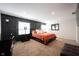 Spacious main bedroom features a large bed, stylish decor, and ample natural light at 6149 W Country Ln, Anderson, IN 46011