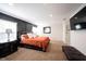 Comfortable main bedroom with a large bed, neutral carpet, and custom trimwork at 6149 W Country Ln, Anderson, IN 46011