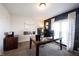 Office space with a large desk, a black accent wall and natural light from a window at 6149 W Country Ln, Anderson, IN 46011